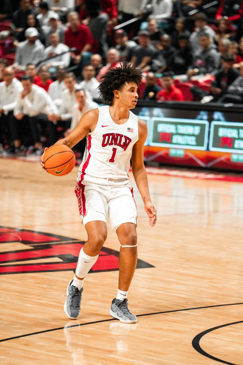Jalen Hill dribbling during a college basketball game for UNLV